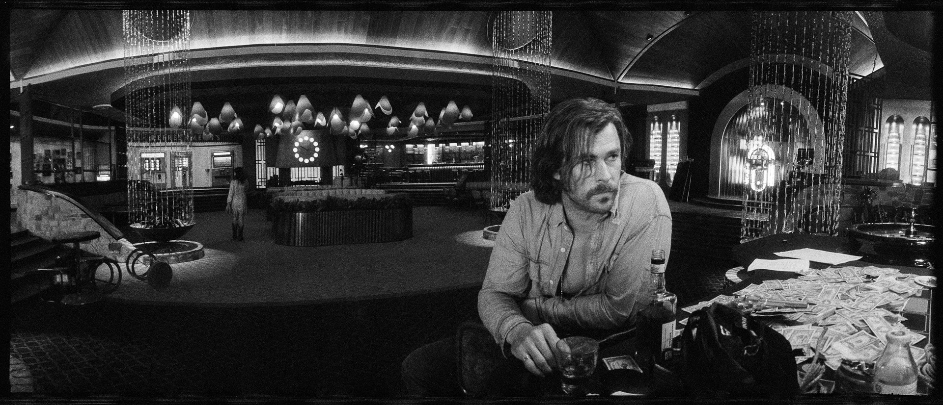 Photo of a man sitting at a bar.