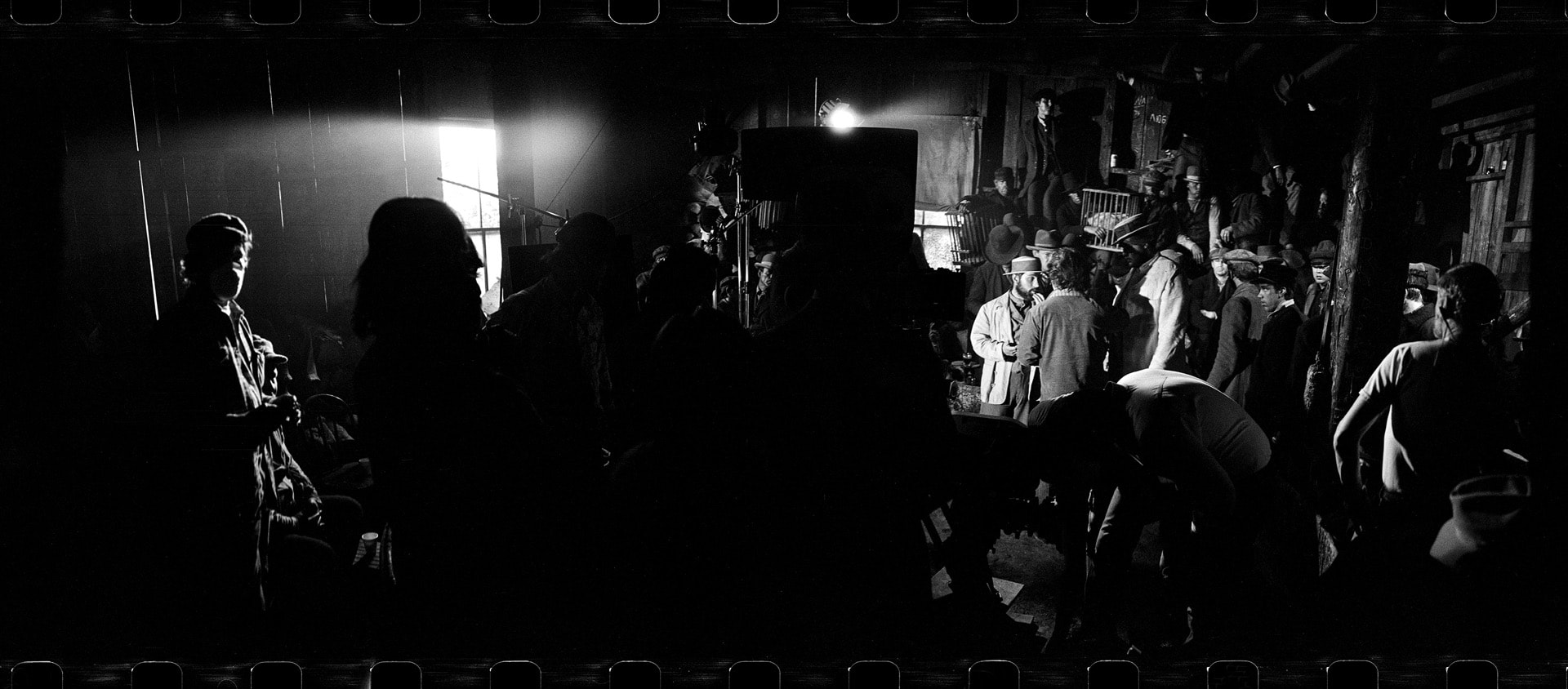 Photo of several people in an old Western movie set.