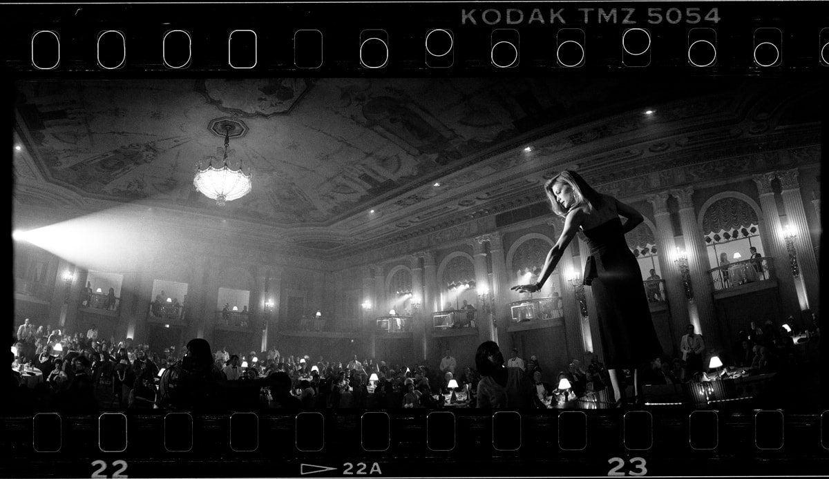 An image showing a best use case with the WideluxX - an interior of a woman singing on a stage.