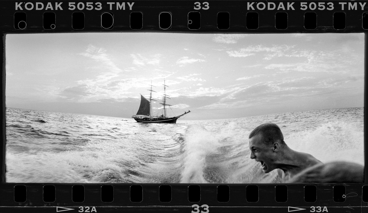 An image showing why the WideluxX isn't for everyone--an ocean scene with a man screaming and a boat in the background.